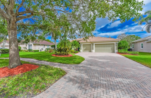 2233 SW Golden Bear Way, Palm City, FL 34990 - view of front of property featuring driveway, a front yard, an attached garage, stucco siding, and a tiled roof
