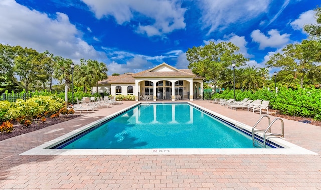 2233 SW Golden Bear Way, Palm City, FL 34990 - community pool with a patio