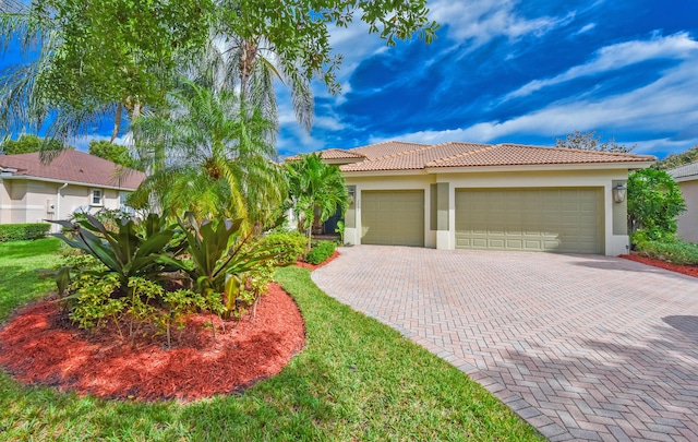 2233 SW Golden Bear Way, Palm City, FL 34990 - view of front of home with stucco siding, decorative driveway, a garage, and a tiled roof