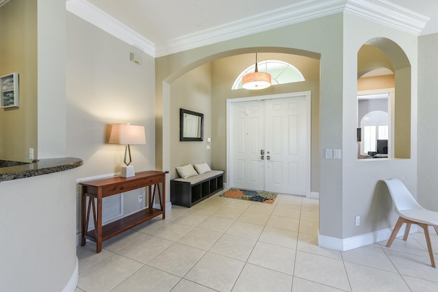 2233 SW Golden Bear Way, Palm City, FL 34990 - foyer featuring ornamental molding, light tile patterned floors, arched walkways, and baseboards