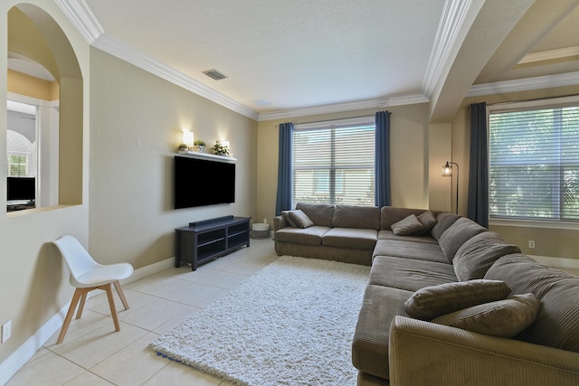 2233 SW Golden Bear Way, Palm City, FL 34990 - living area featuring ornamental molding, light tile patterned floors, baseboards, and arched walkways