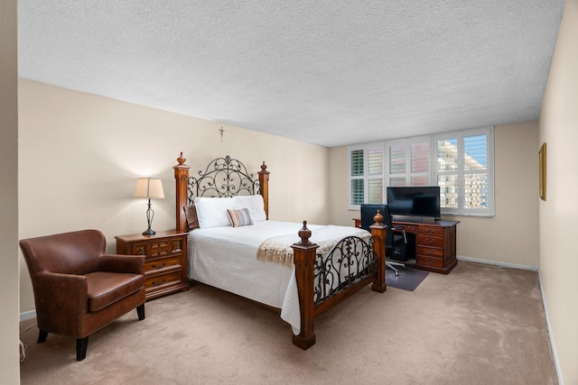 carpeted bedroom with a textured ceiling