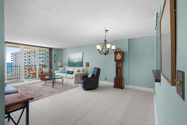 living room with floor to ceiling windows, a chandelier, and a textured ceiling