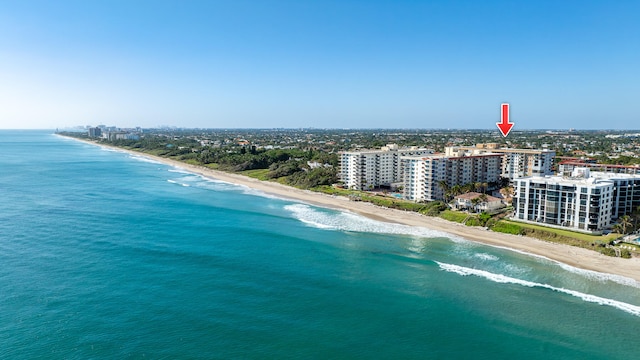 aerial view with a water view and a view of the beach