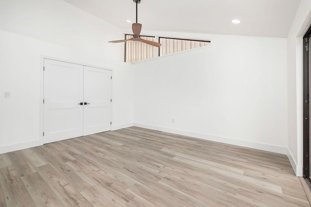 interior space featuring light hardwood / wood-style floors, ceiling fan, and lofted ceiling