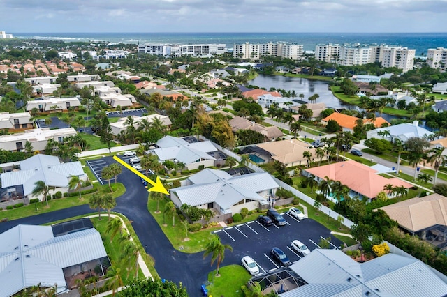 birds eye view of property featuring a water view