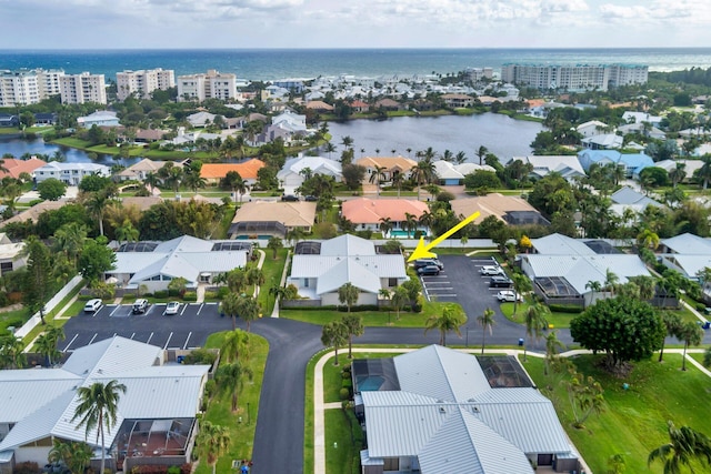 drone / aerial view with a water view