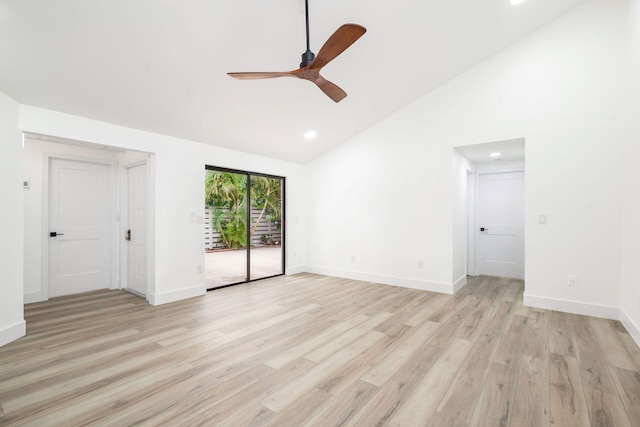 spare room with ceiling fan, high vaulted ceiling, and light hardwood / wood-style floors