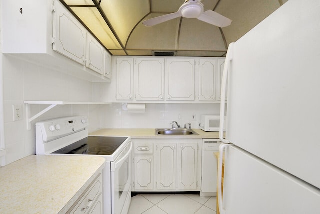 kitchen featuring backsplash, white cabinetry, white appliances, and sink