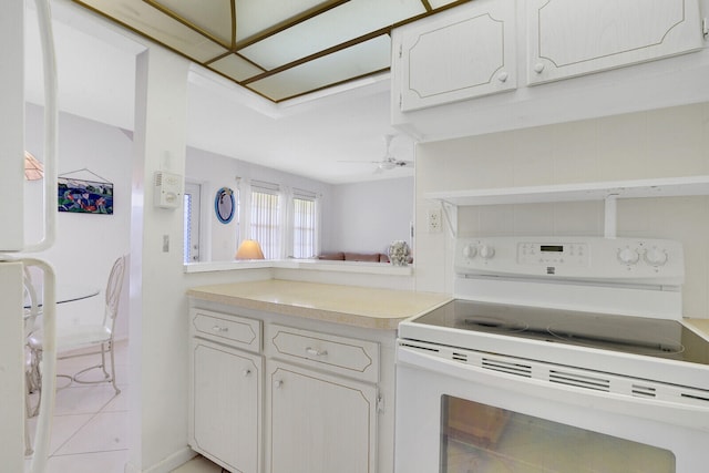 kitchen featuring ceiling fan, light tile patterned floors, white cabinets, and white appliances