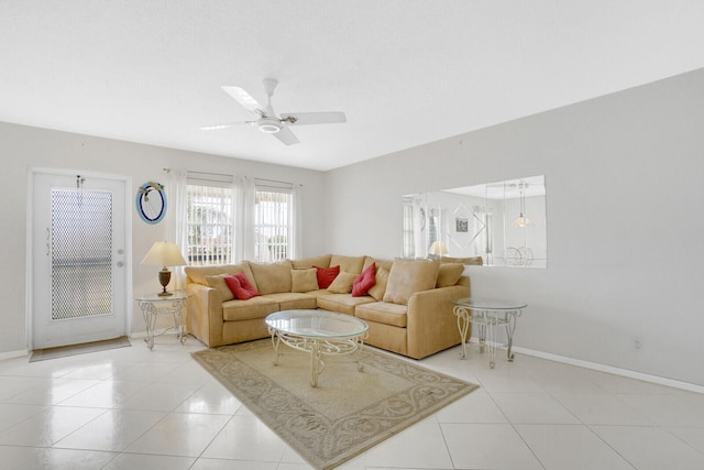 tiled living room with ceiling fan