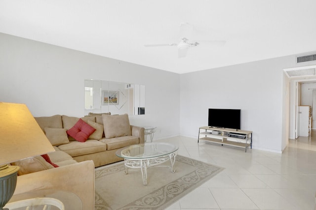 tiled living room featuring ceiling fan