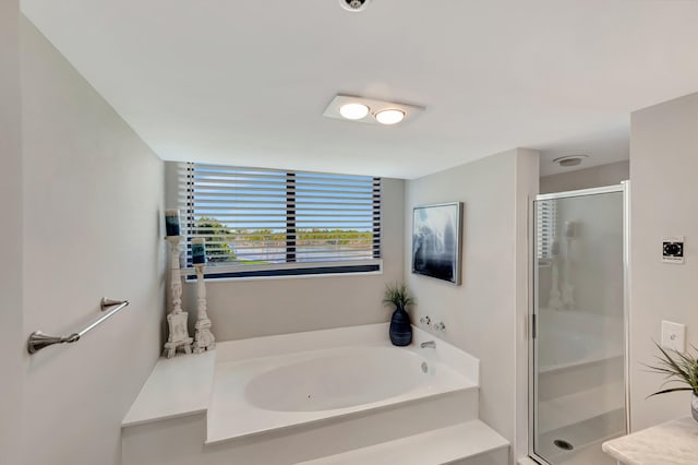 bathroom with independent shower and bath