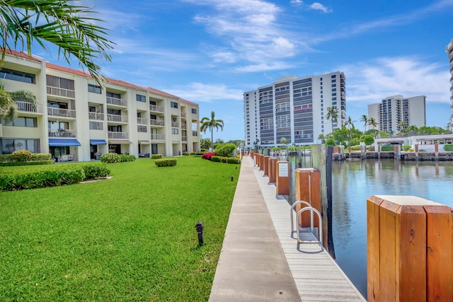 dock area featuring a yard and a water view