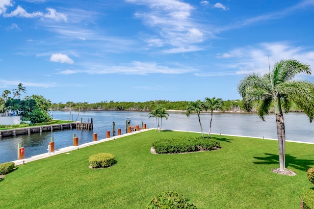 exterior space featuring a water view and a lawn