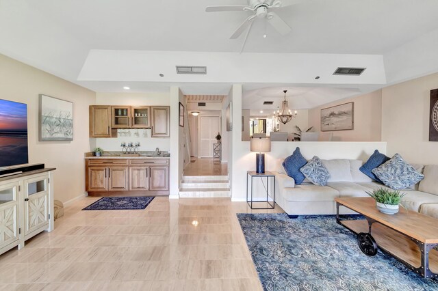 4744 S Ocean Blvd Unit C-112, Highland Beach, FL 33487 - living room featuring a chandelier, baseboards, ceiling fan, light tile patterned floors, and a raised ceiling