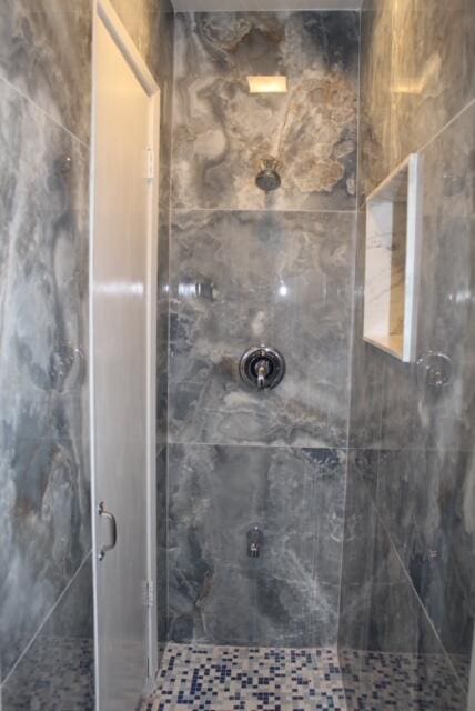 bathroom featuring walk in shower