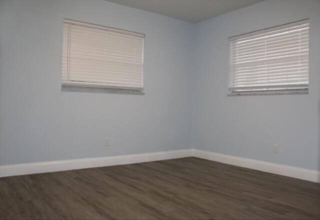 empty room featuring dark hardwood / wood-style floors