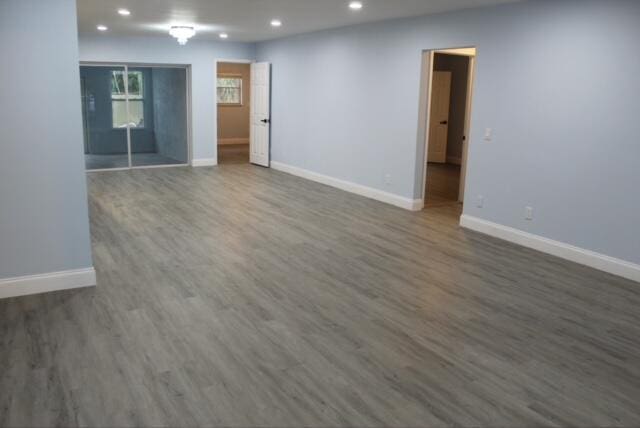 spare room with dark hardwood / wood-style floors