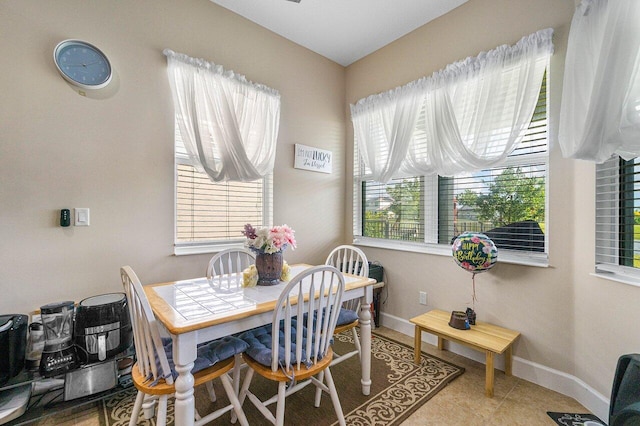 dining space featuring tile patterned floors