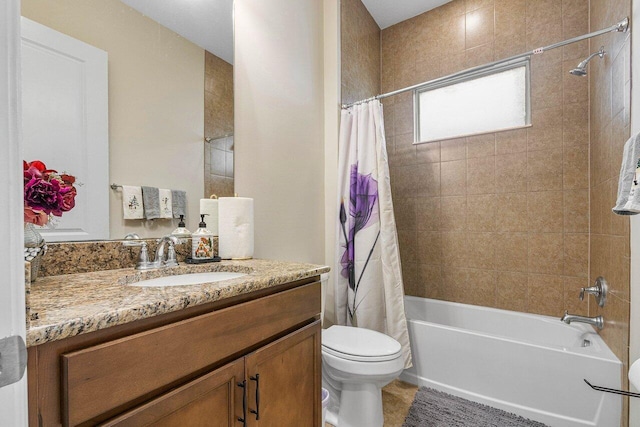 full bathroom featuring vanity, shower / bath combination with curtain, and toilet