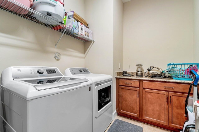 washroom with washer and dryer