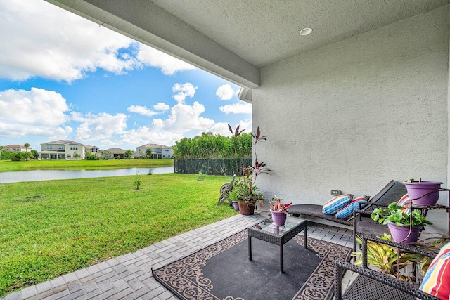 view of patio featuring a water view