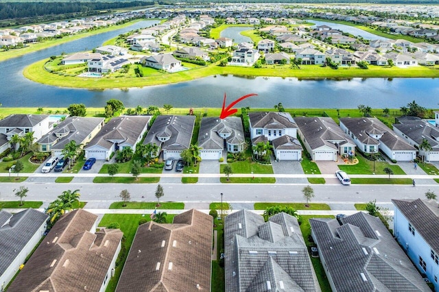 birds eye view of property featuring a water view