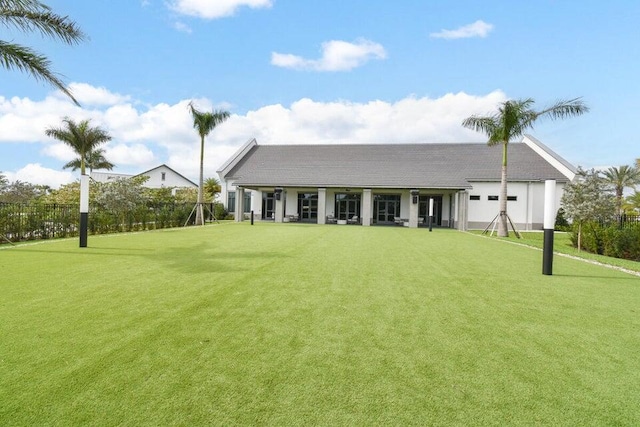 rear view of house with a yard