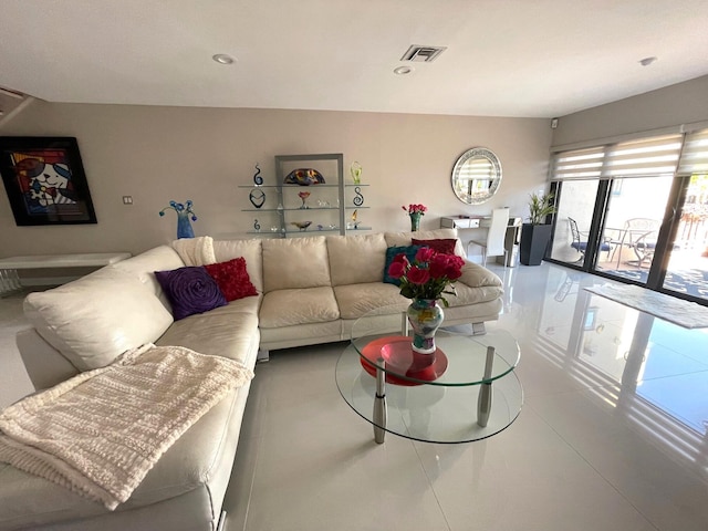 living room with tile patterned floors