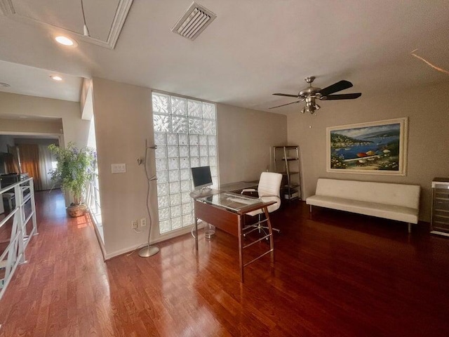 office space with attic access, baseboards, visible vents, ceiling fan, and wood finished floors