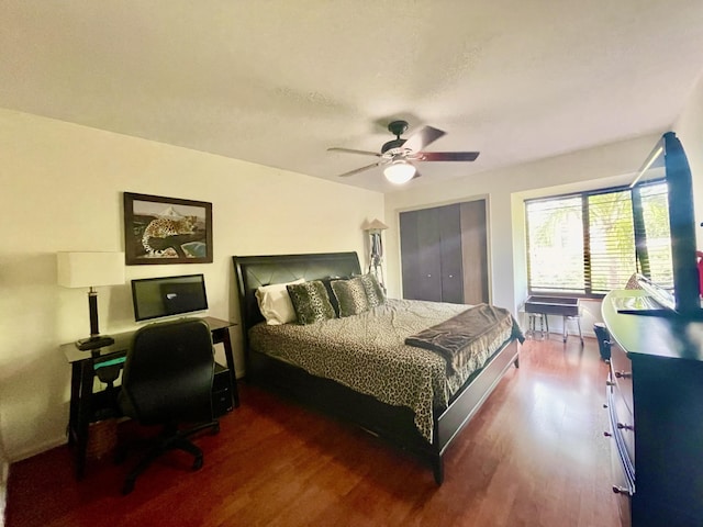 bedroom featuring ceiling fan and dark wood finished floors