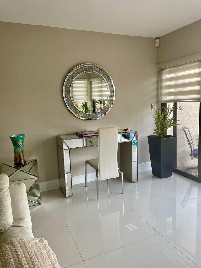 office featuring baseboards and tile patterned floors