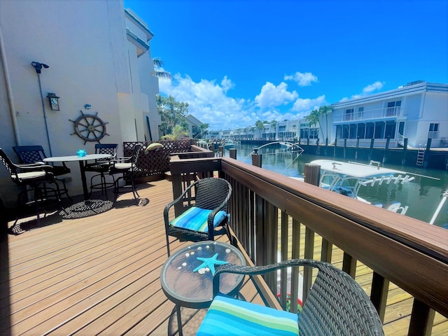 deck featuring a water view