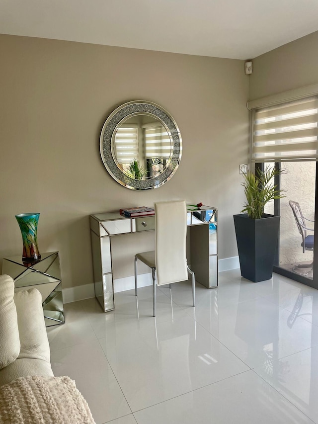1127 Boca Cove Ln Unit 3, Highland Beach, FL 33487 - tiled dining room with baseboards and a desk