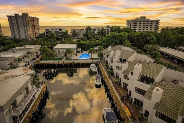 aerial view at dusk with a water view