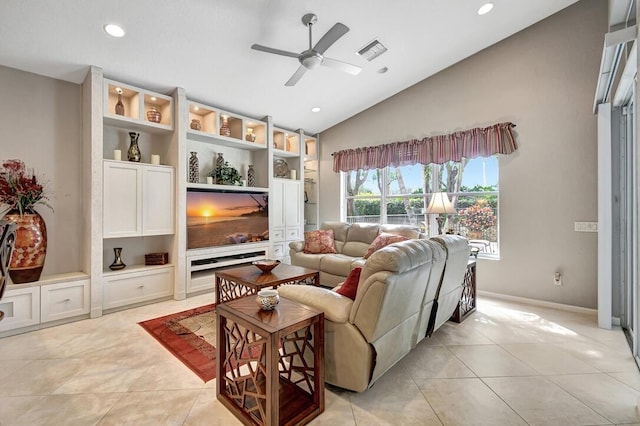 tiled living room featuring ceiling fan and lofted ceiling