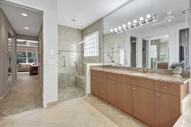 bathroom with vanity, tile patterned floors, and walk in shower