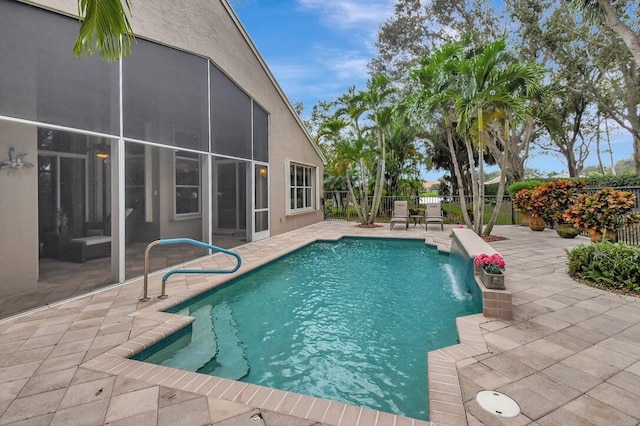 view of pool featuring pool water feature and a patio area