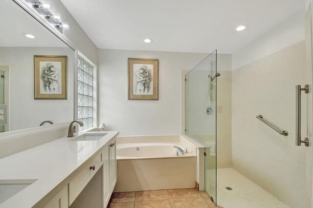 bathroom with separate shower and tub, tile patterned flooring, and vanity