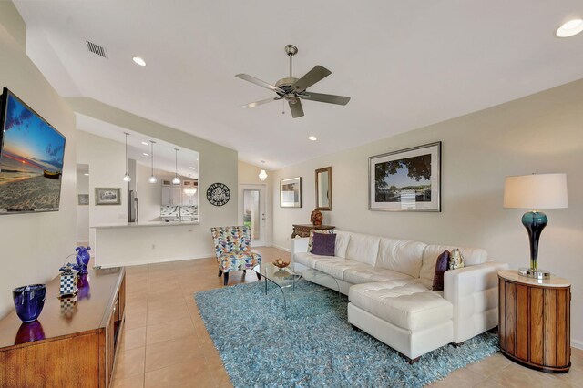 dining area with a chandelier, light tile patterned floors, high vaulted ceiling, and a wealth of natural light