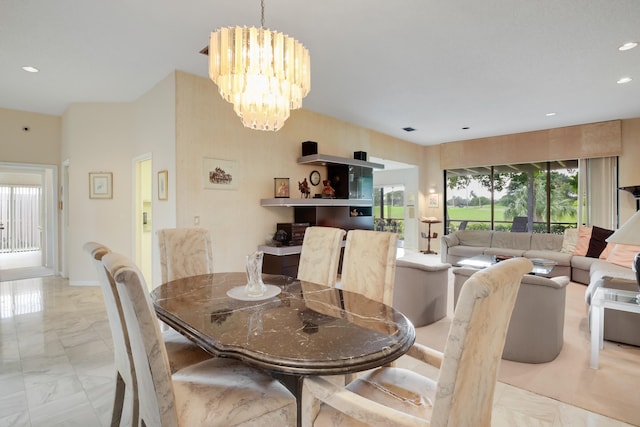 dining room with a notable chandelier