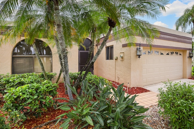 view of side of property with a garage