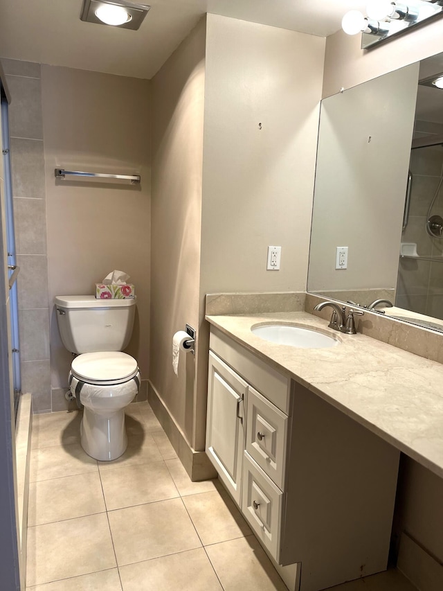 bathroom featuring walk in shower, tile patterned flooring, vanity, and toilet