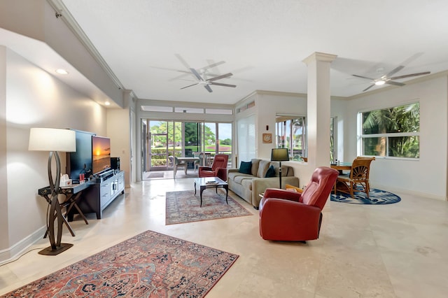 living room featuring ceiling fan, ornate columns, and ornamental molding