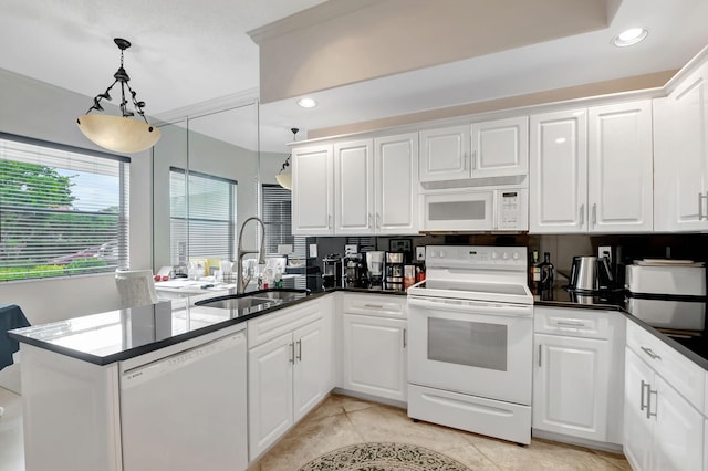 kitchen featuring white cabinetry and white appliances