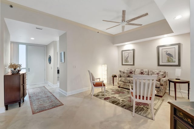 living room featuring ceiling fan and crown molding