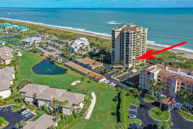 bird's eye view featuring a view of the beach and a water view