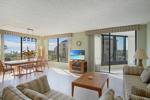 living room featuring light tile patterned floors and a textured ceiling