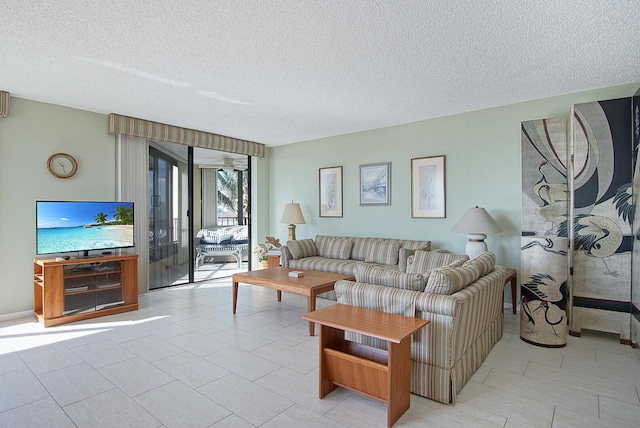 living room featuring a textured ceiling and light tile patterned flooring